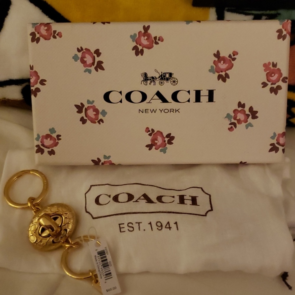 Beautiful Coach gold turn lock keychain